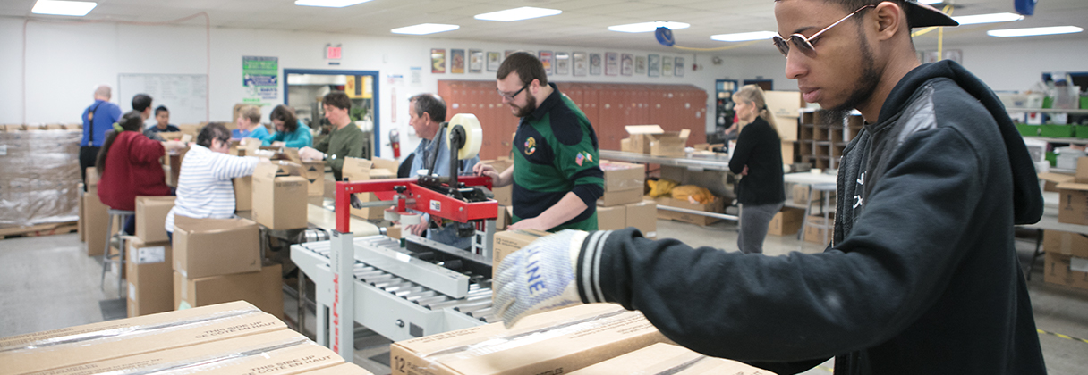 Employees working an assembly line