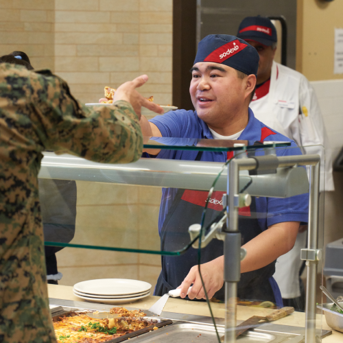 Person with disability serving veterans meals
